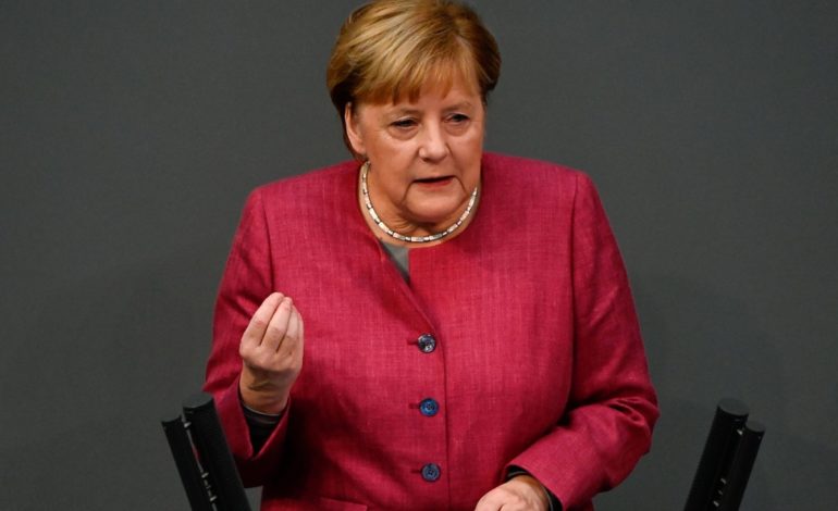 Merkel targets China on human rights and trade but tempers with praise on climate
