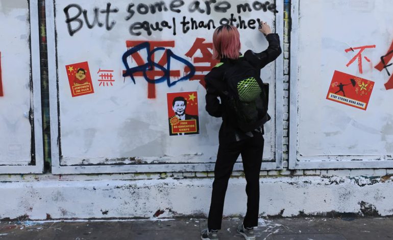 Chinese propaganda slogans turn London street art wall into a protest site against Beijing